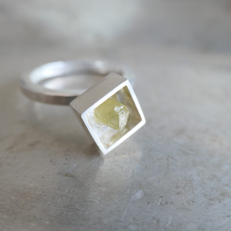 Photo of raw diamond in square ring